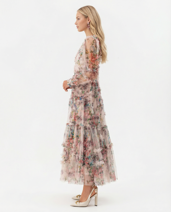 Woman wearing a floral ruffle maxi dress with defined bodice on a plain background.
