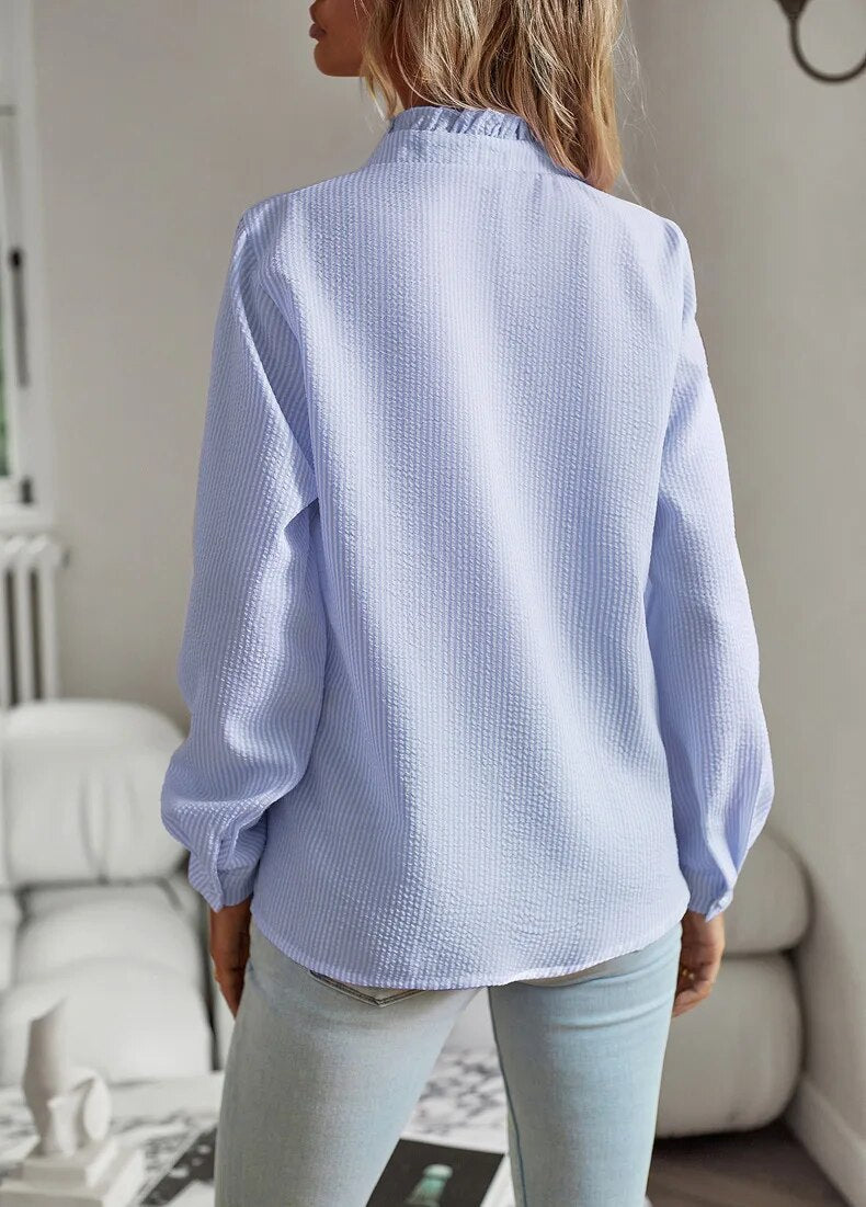 Draped front top with refined neckline shown on a model against a clean background, back angle