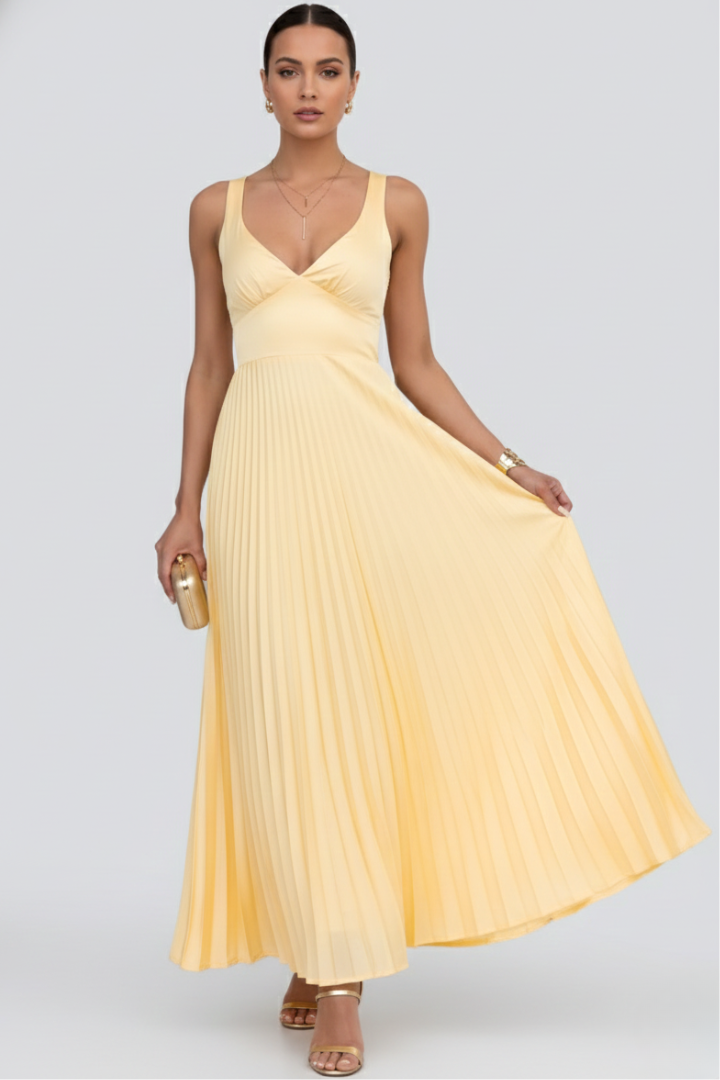 Front view model in pale yellow pleated maxi dress studio