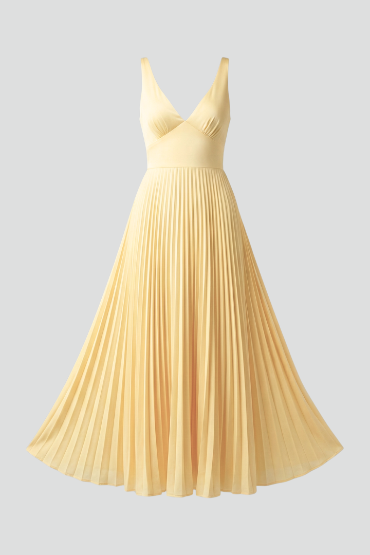 Long pleated formal wear dress shown on gray backdrop
