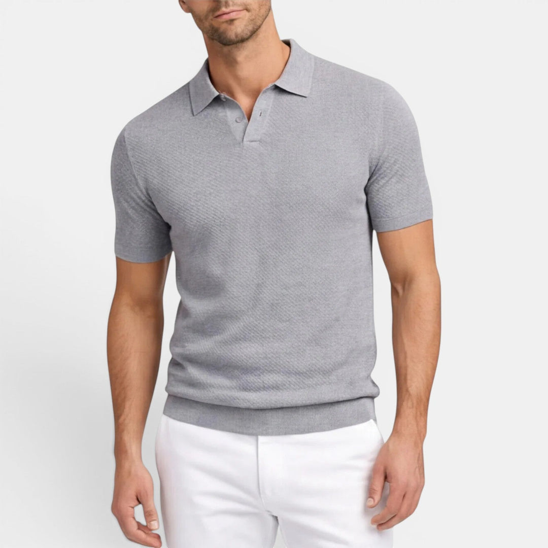  Model wearing a refined knit polo shirt with a clean collar and simple styling.