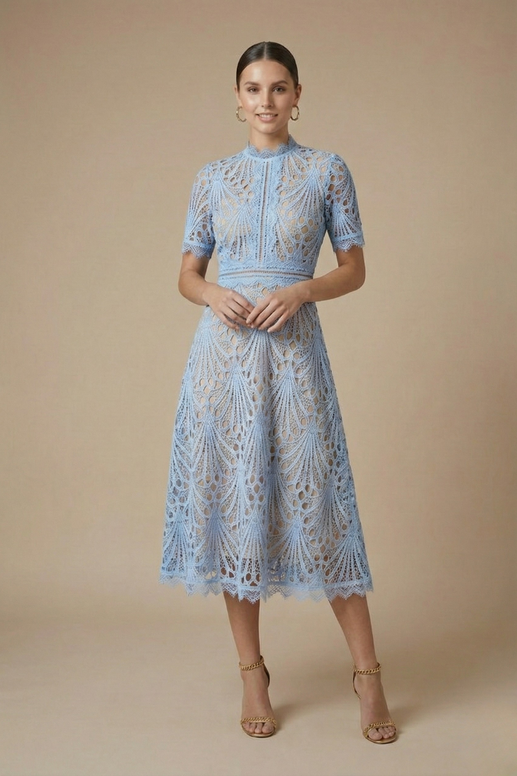 Female in a lace midi dress with textured detailing and short sleeves displayed on a pl