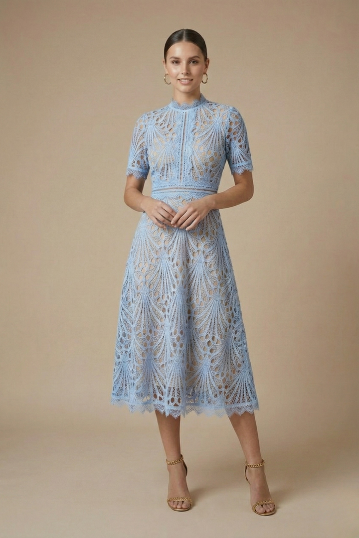 Female in a lace midi dress with textured detailing and short sleeves displayed on a pl