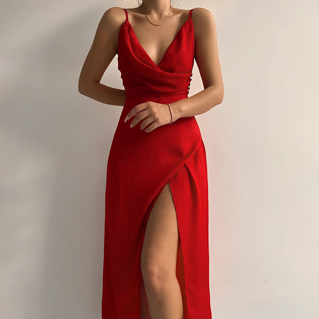 Model showcasing a stylish strapless dress with a plain background.