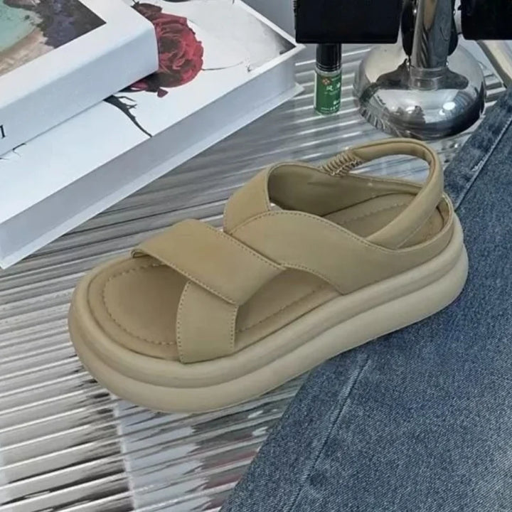 Female model wearing wedge sandals designed for casual walking and daily outfits.