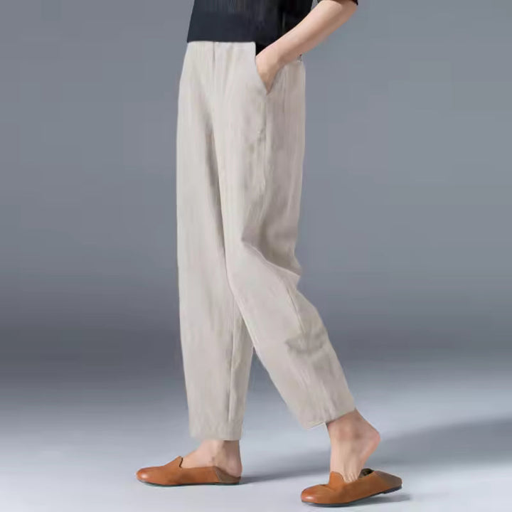 Relaxed women’s lightweight pants styled on a plain background for everyday wear.