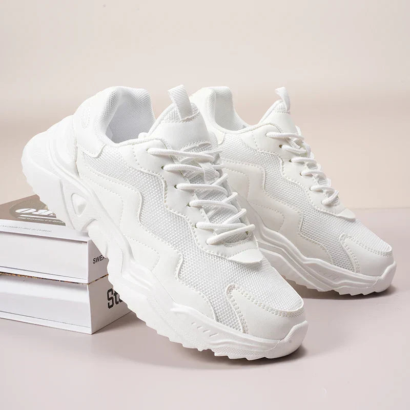Women’s breathable mesh sneakers on a plain background for casual daily wear.