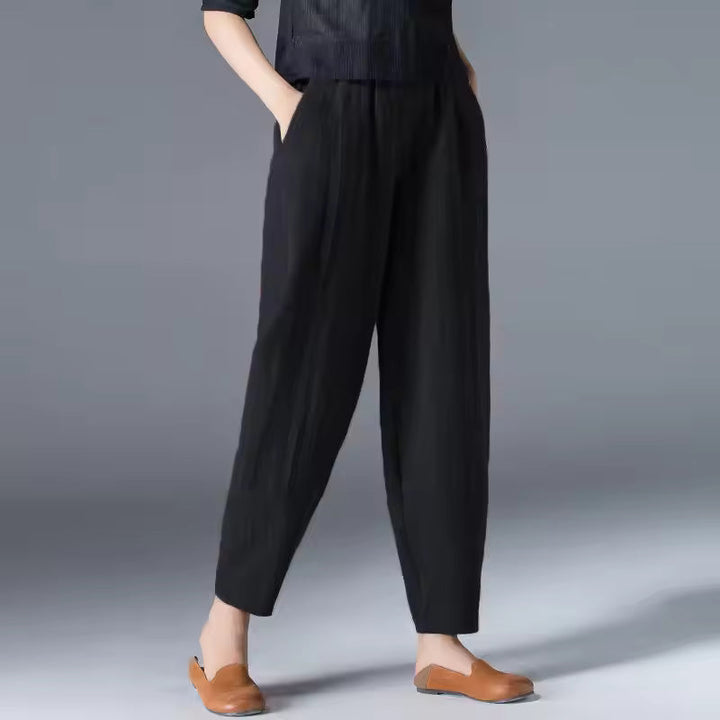 Women’s casual lightweight pants on a plain background with a flattering relaxed shape.