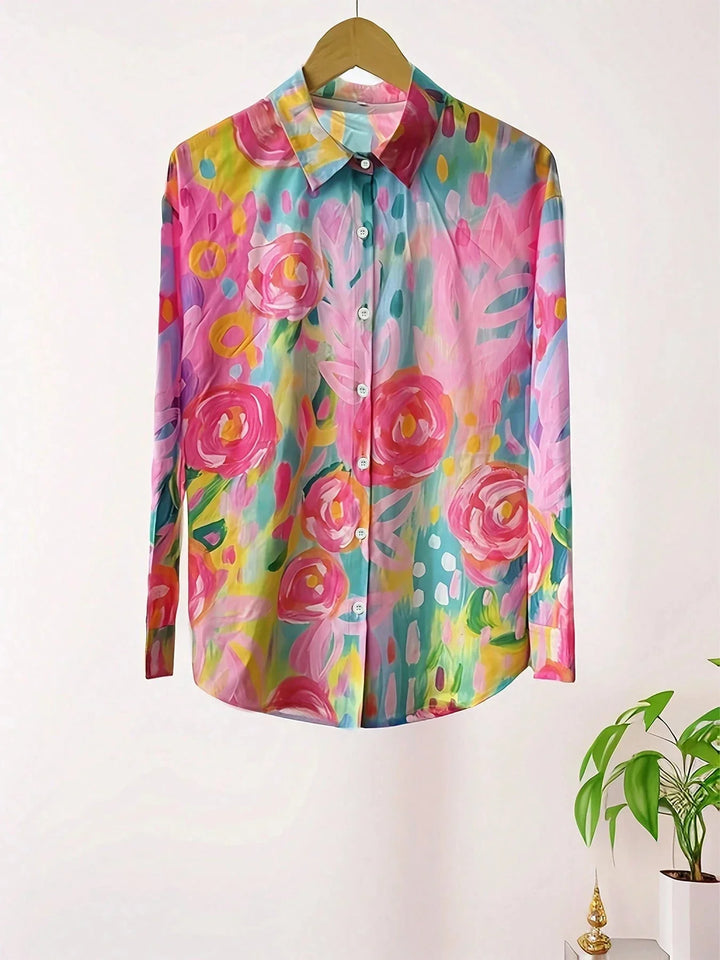 Vibrant women’s printed top shown against a plain background.