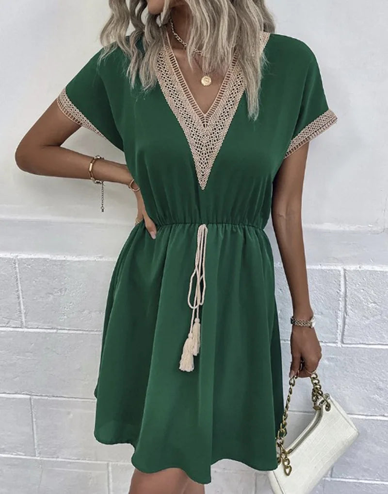 Flowy V-neck dress shown on a plain background with an easy everyday shape.