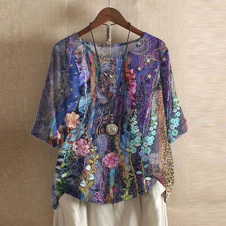 Soft classic blouse shown unworn on a clean background with subtle gathers and refined detail.