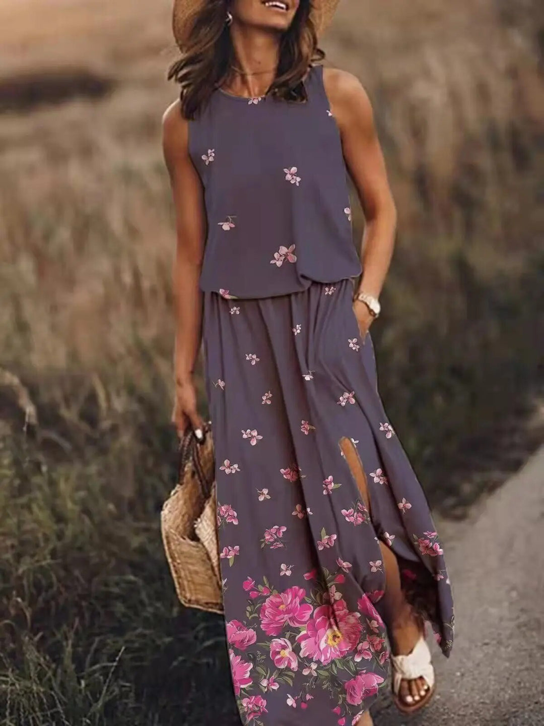 Sleeveless full-length dress displayed on a female model with a plain backdrop.