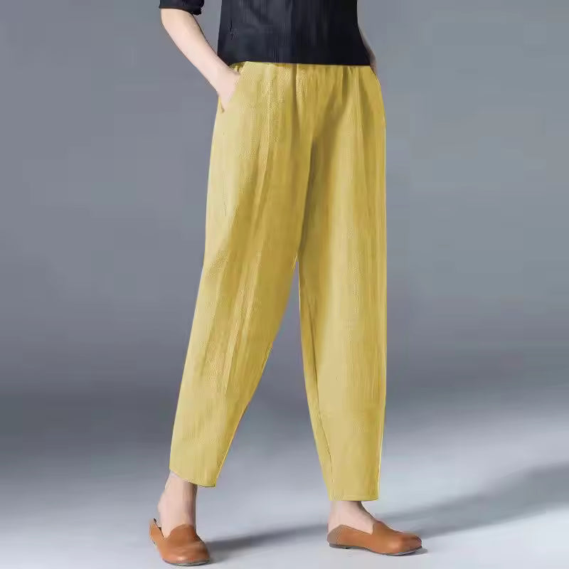 Airy women’s summer pants shown on a plain background with a soft draped fit.
