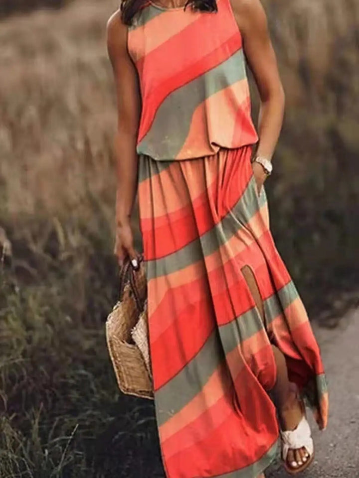 Woman modeling a lightweight sleeveless dress with full-length silhouette on a plain backdrop.