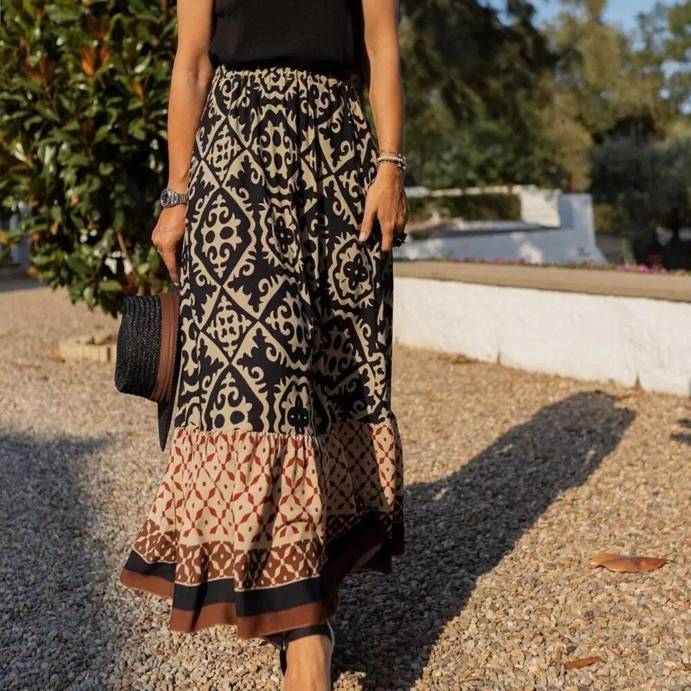 Vibrant summer maxi skirt with layered ruffle detail on a nature background.