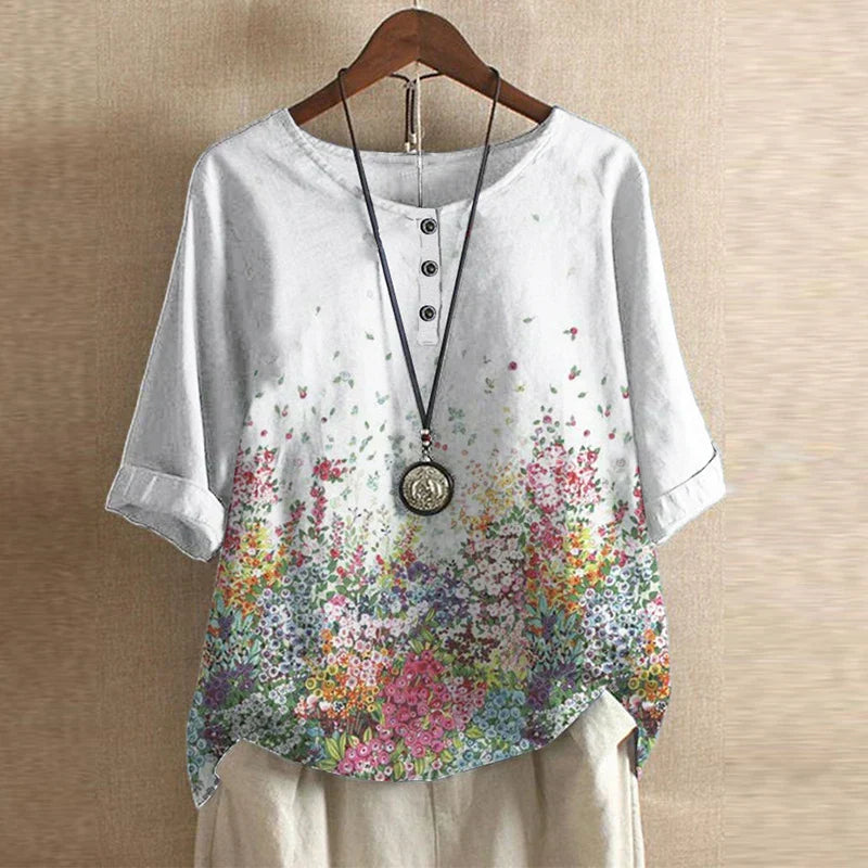 Mature women’s elegant blouse displayed unworn against a clean background with classic charm.
