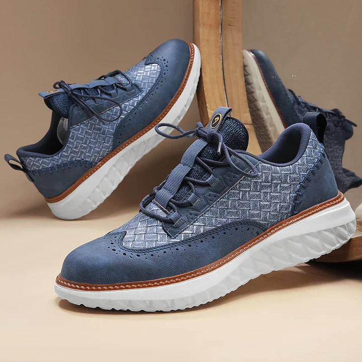 Lightweight lace-up sneakers on a plain backdrop.