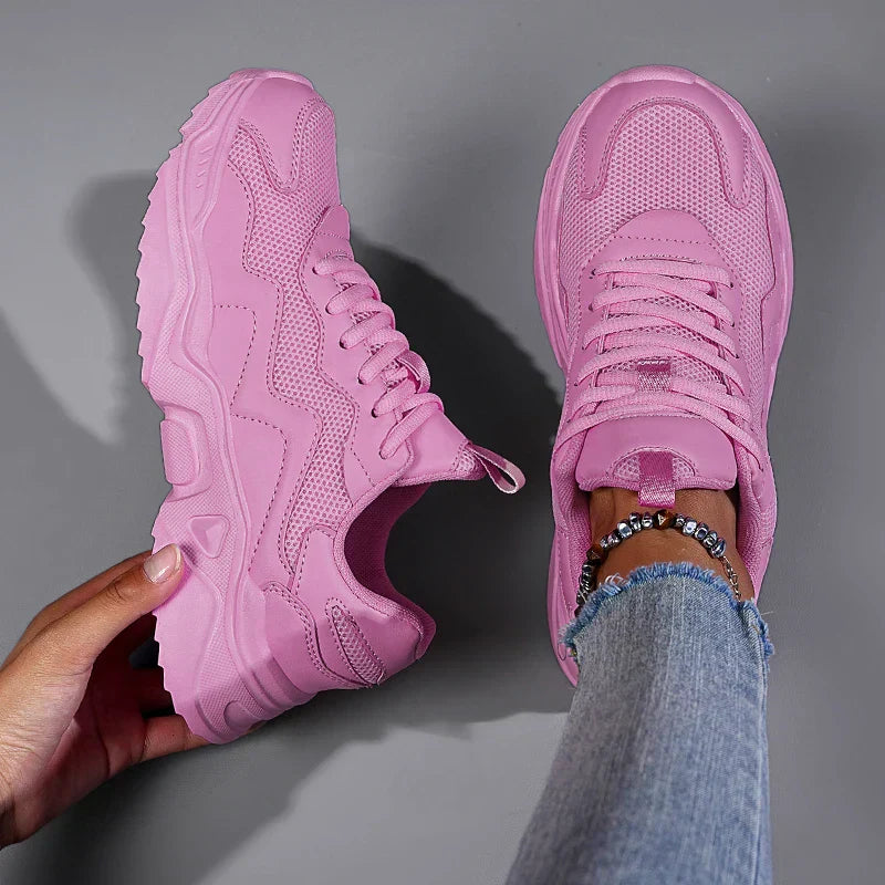 Breathable women’s active sneakers displayed with a clean minimal backdrop.