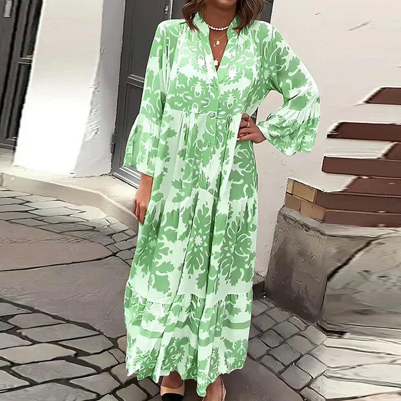 Breezy bohemian maxi dress with colorful artistic details.