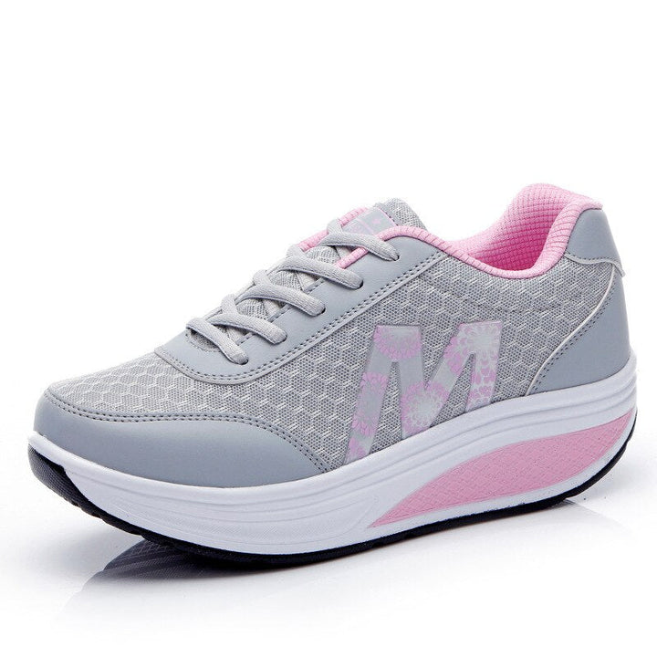 Casual walking shoes on a plain background.
