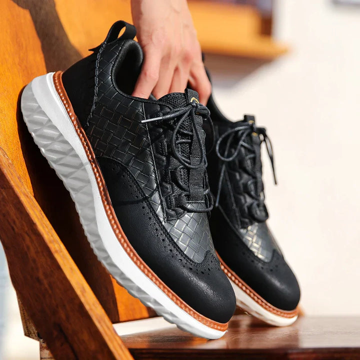 Men’s everyday sneakers shown from the side on a plain backdrop.