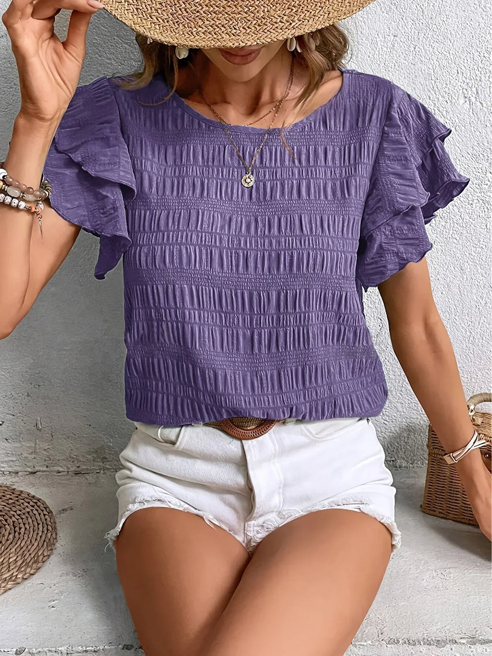 feminine relaxed-fit blouse on a clean background.