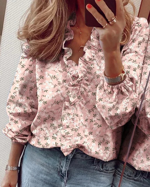 Lightweight ruffle blouse styled on a person against a neutral background.
