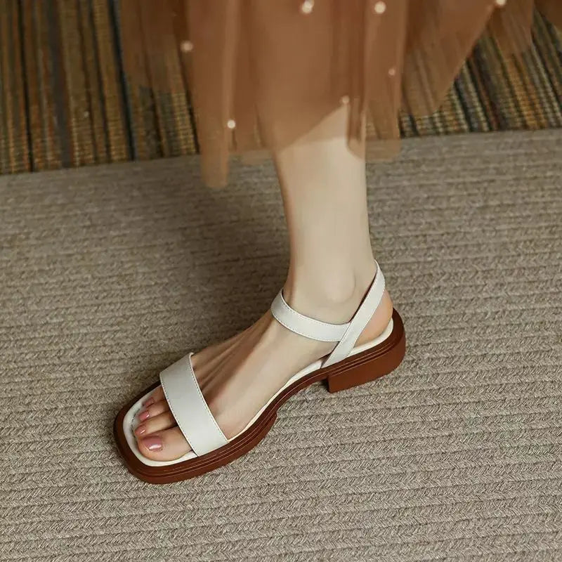 Women’s everyday sandal featuring a cushioned footbed on a clean background.