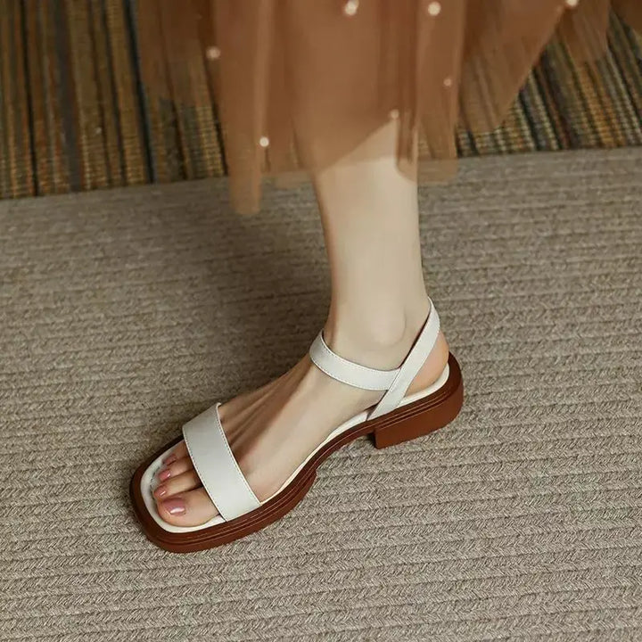 Women’s everyday sandal featuring a cushioned footbed on a clean background.