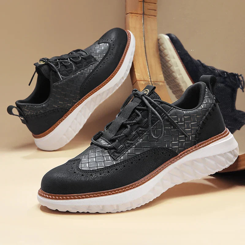 Sleek walking shoes on plain background.