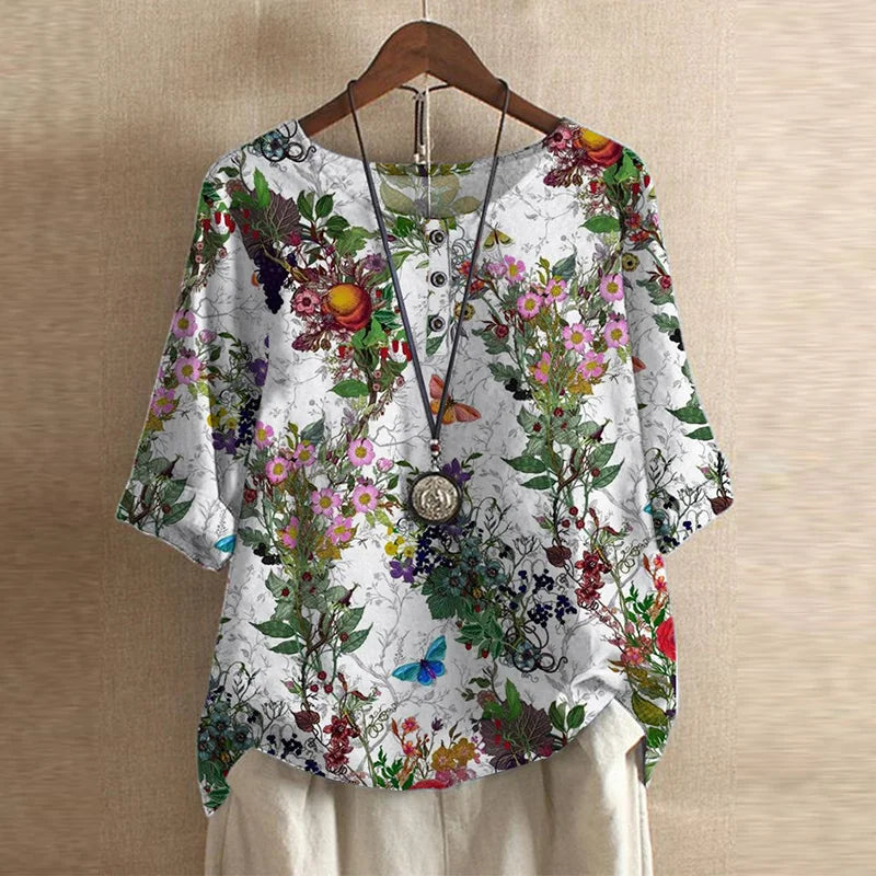 Vintage charm women’s blouse displayed on a plain background with flattering midsection design.
