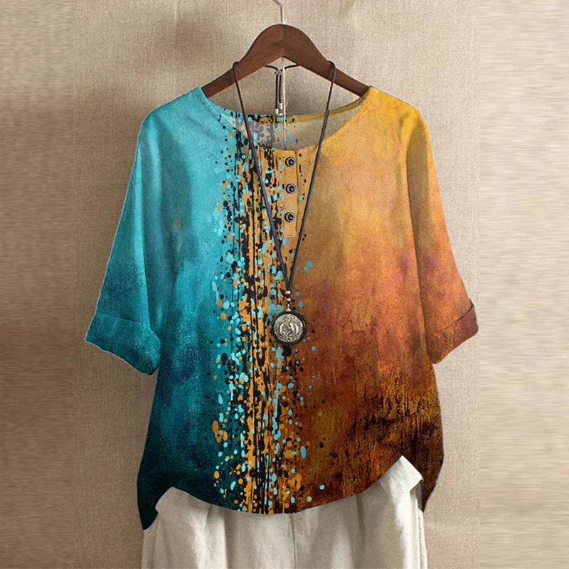 Feminine retro blouse displayed on a plain background with modest coverage and timeless appeal.
