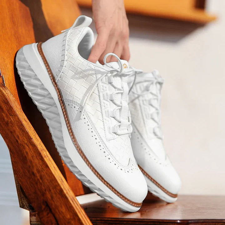 Breathable lace-up shoes displayed on feet with a clean background.