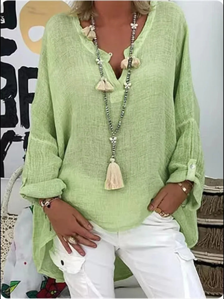Breathable elegant blouse featuring a model on a plain background with relaxed silhouette.