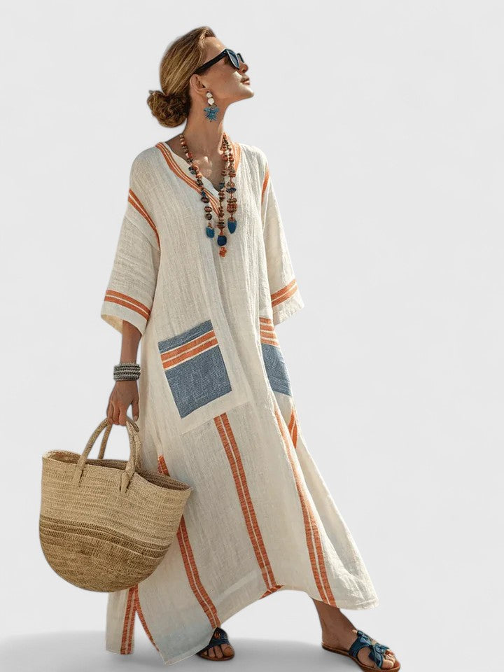  Model in a colorful striped summer maxi dress with relaxed sleeve