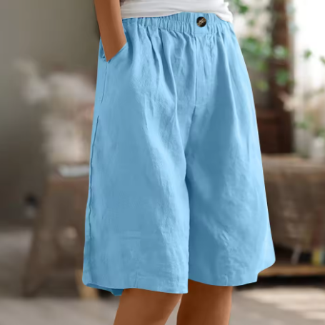 Female model displaying soft fabric comfort shorts against a plain background.