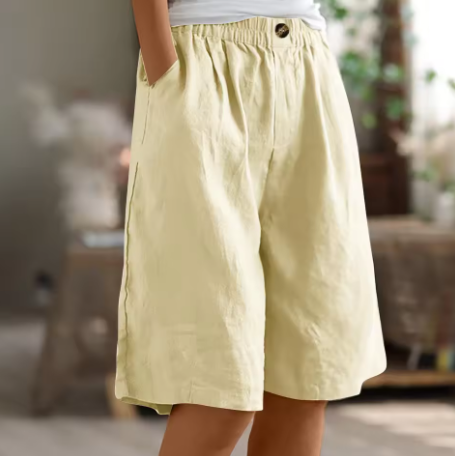 Model wearing soft relaxed-fit women’s shorts against a plain background.