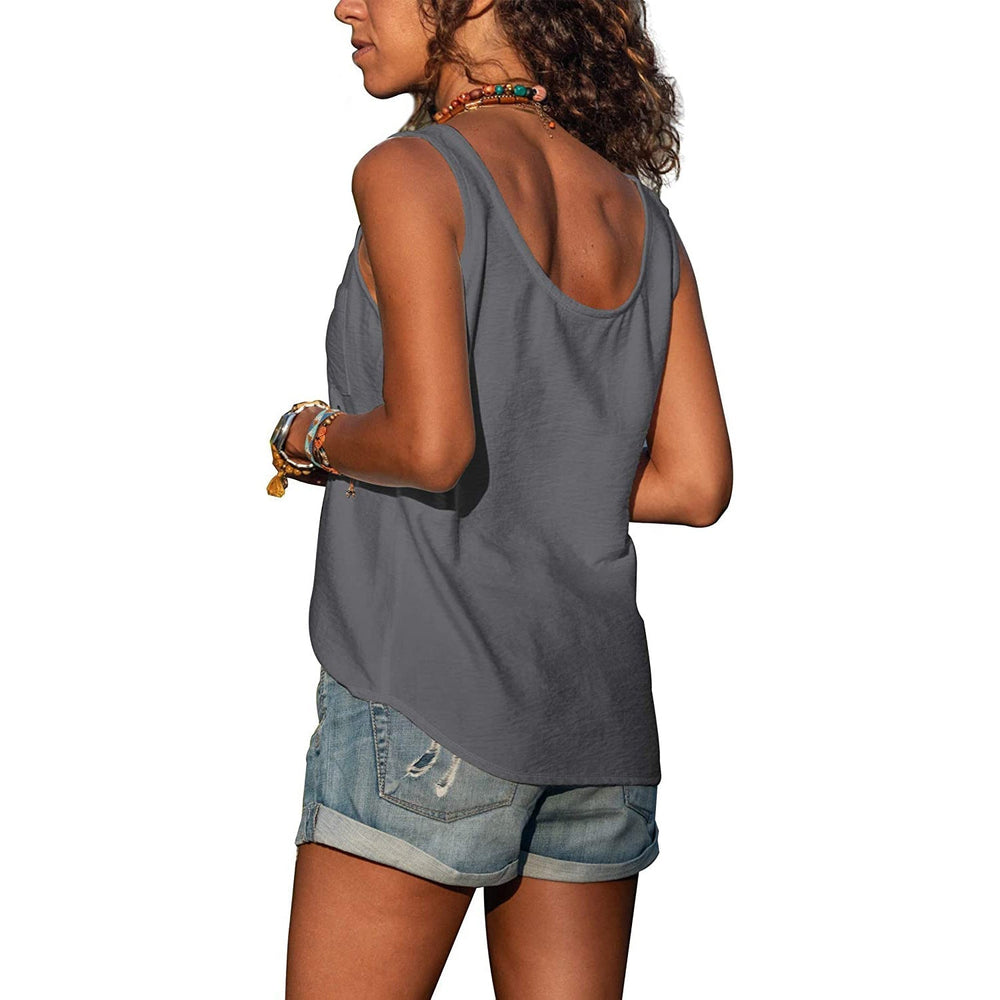 Woman model posing sideways in sleeveless top on plain background.
