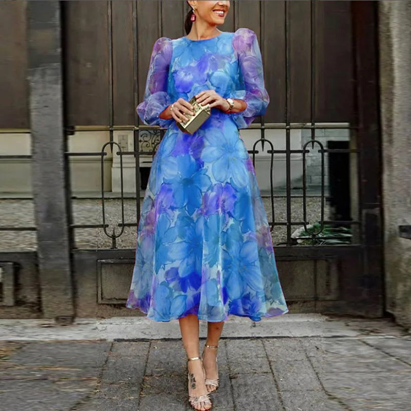 Woman in a formal floral midi dress shown on a plain background.