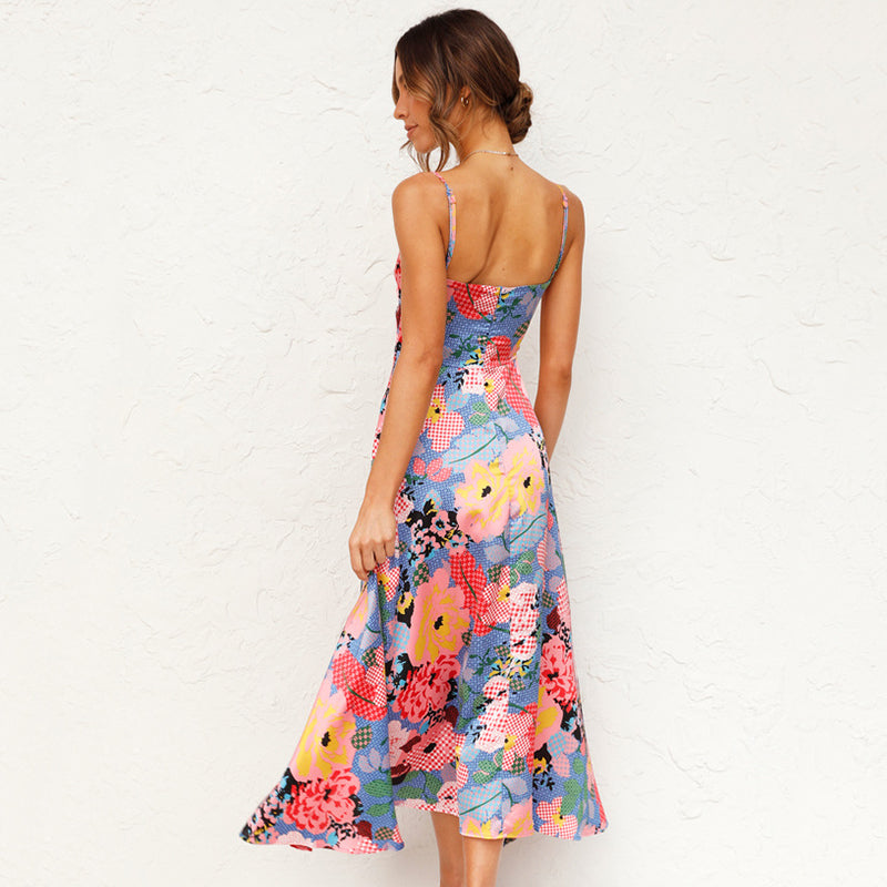 Woman wearing flowy summer dress plain background