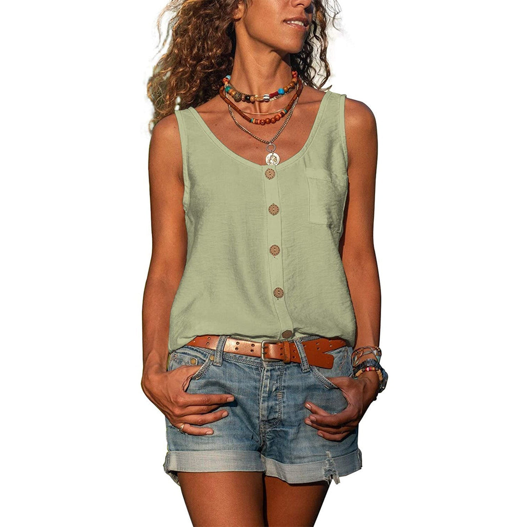Woman model posing confidently in modern top, plain background setting.