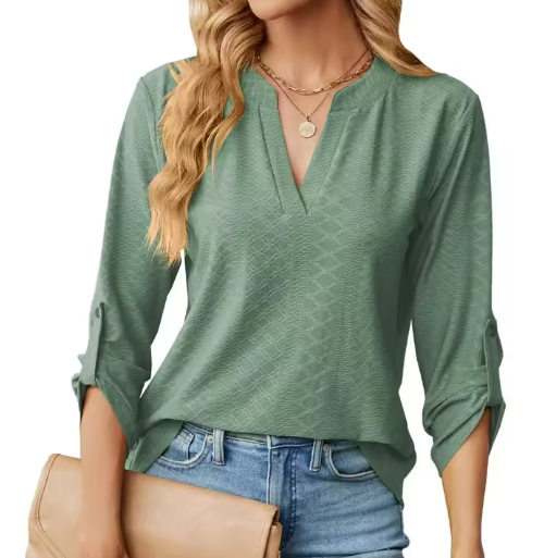 Elegant women’s blouse shown on a wearer against a plain background.