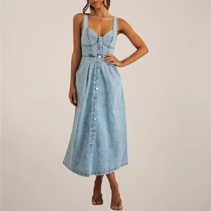 Female showcasing a sleeveless belted midi dress with a flowing skirt on a plain background.