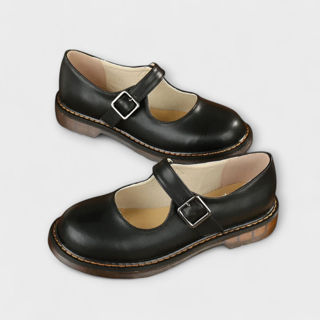 Slim strap dress sandal shown on foot with plain background.