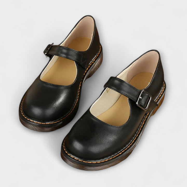 Foot displaying a refined heeled sandal with slim straps.