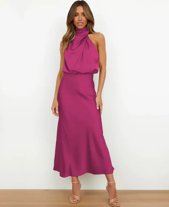 Female model wearing a sleeveless midi dress for everyday styling on a plain background.