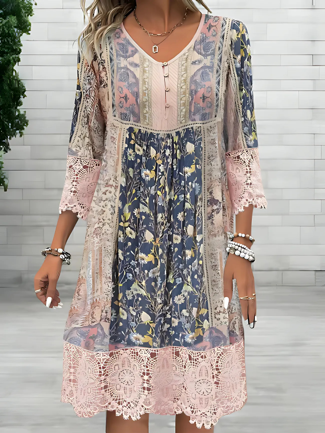 Woman wearing a flowy boho midi dress on a plain background.