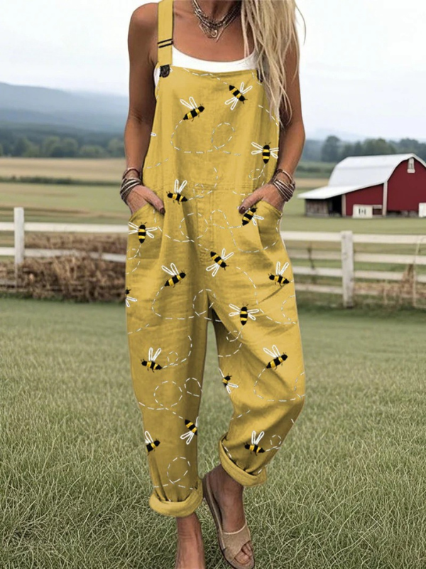Female model standing in a lightweight bee jumpsuit with neutral backdrop.