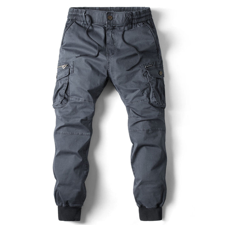 Contemporary cargo pants with multiple pockets on a plain background.