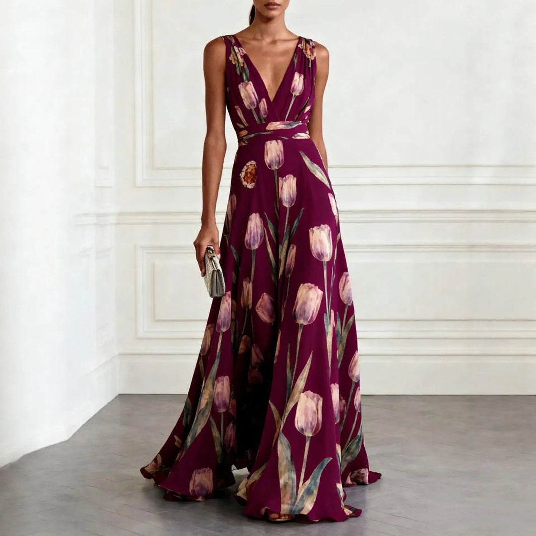 Female model showcasing a deep V floral evening dress on a plain background.